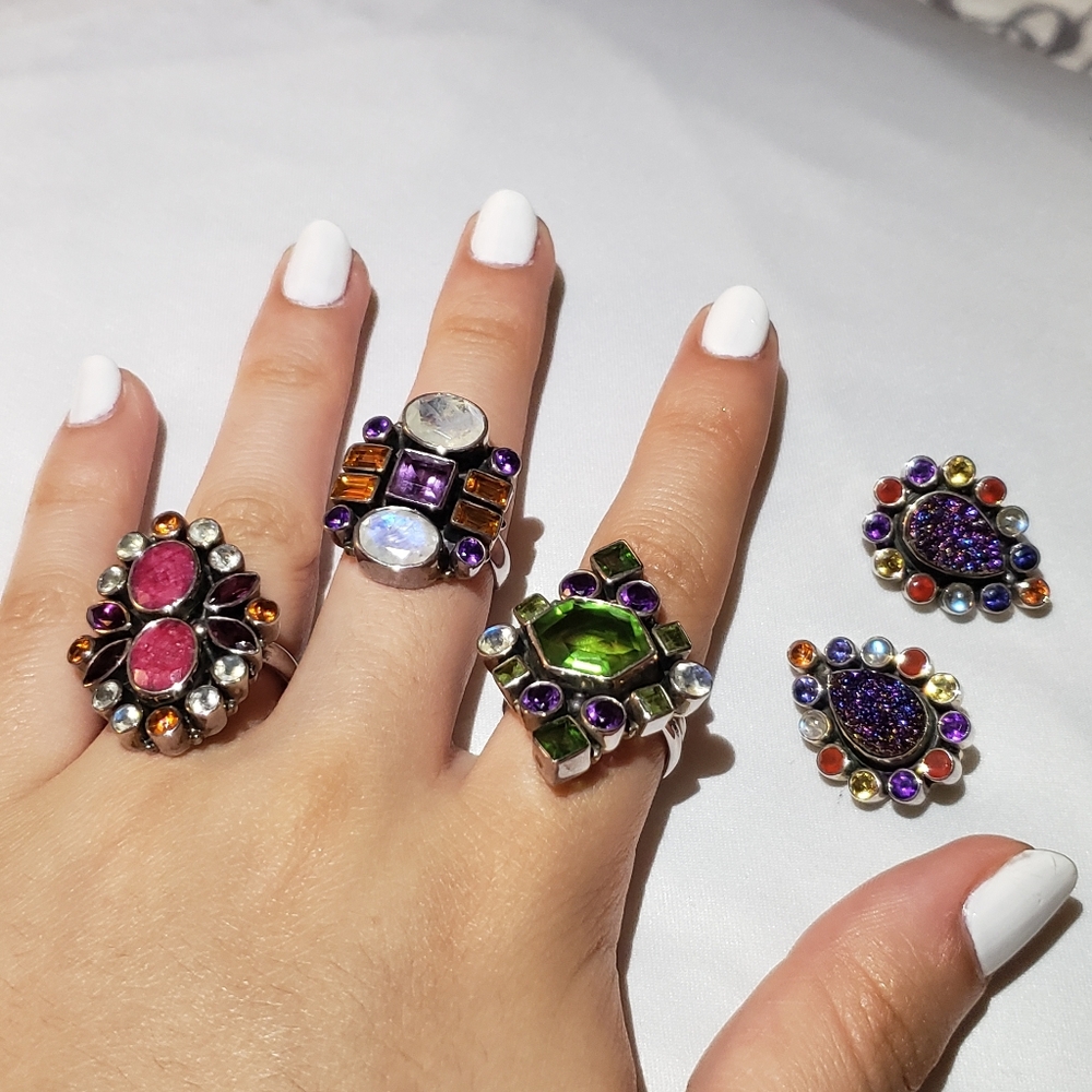 3 rings and a pair of earing